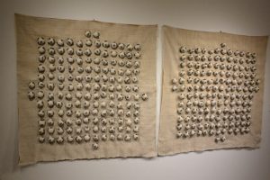 301 balls (Diptych), 2017 Cotton thread, coal from Soma, Turkey, fabric 36 × 37 in, 2017. Photo by Tom Grotta