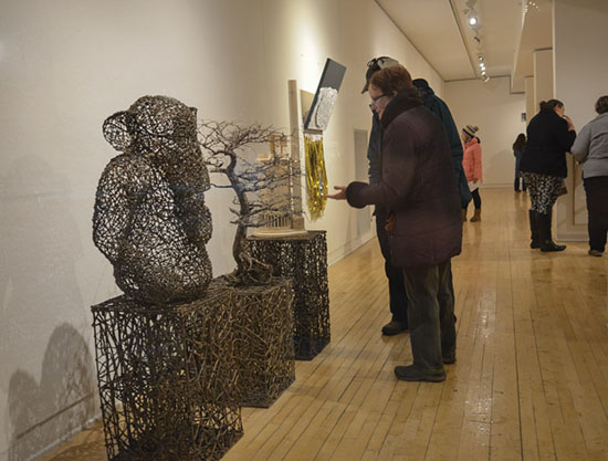 attendees viewing "Same Difference" by John McQueen