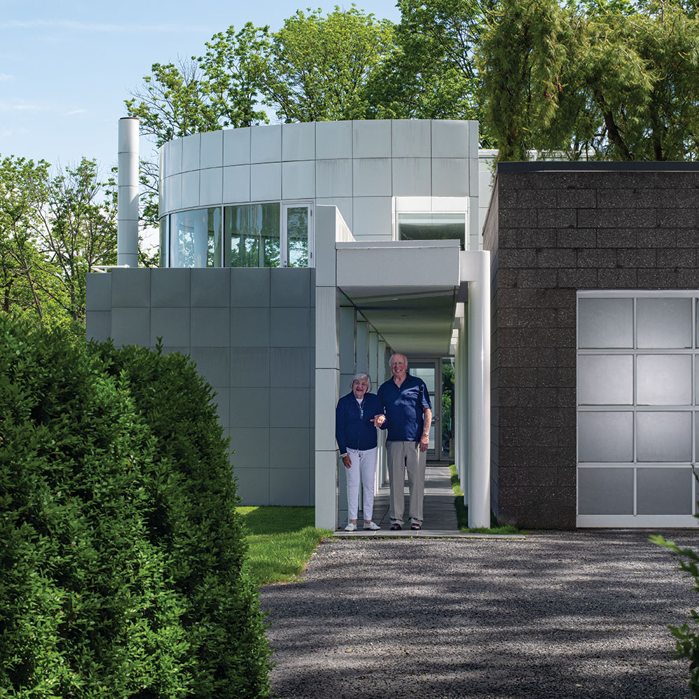 Sandy and Lou Grotta in front of the Grotta House from The Grotta Home by Richard Meier: A Marriage of Architecture and Craft published by Arnoldsche, photo by Tom Grotta