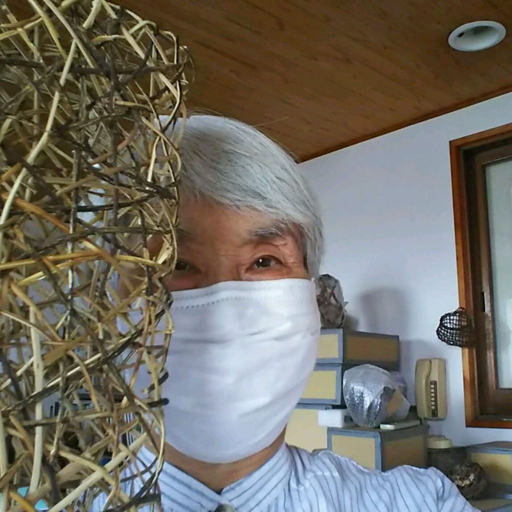 Hisako Sekijima at home wearing a mask